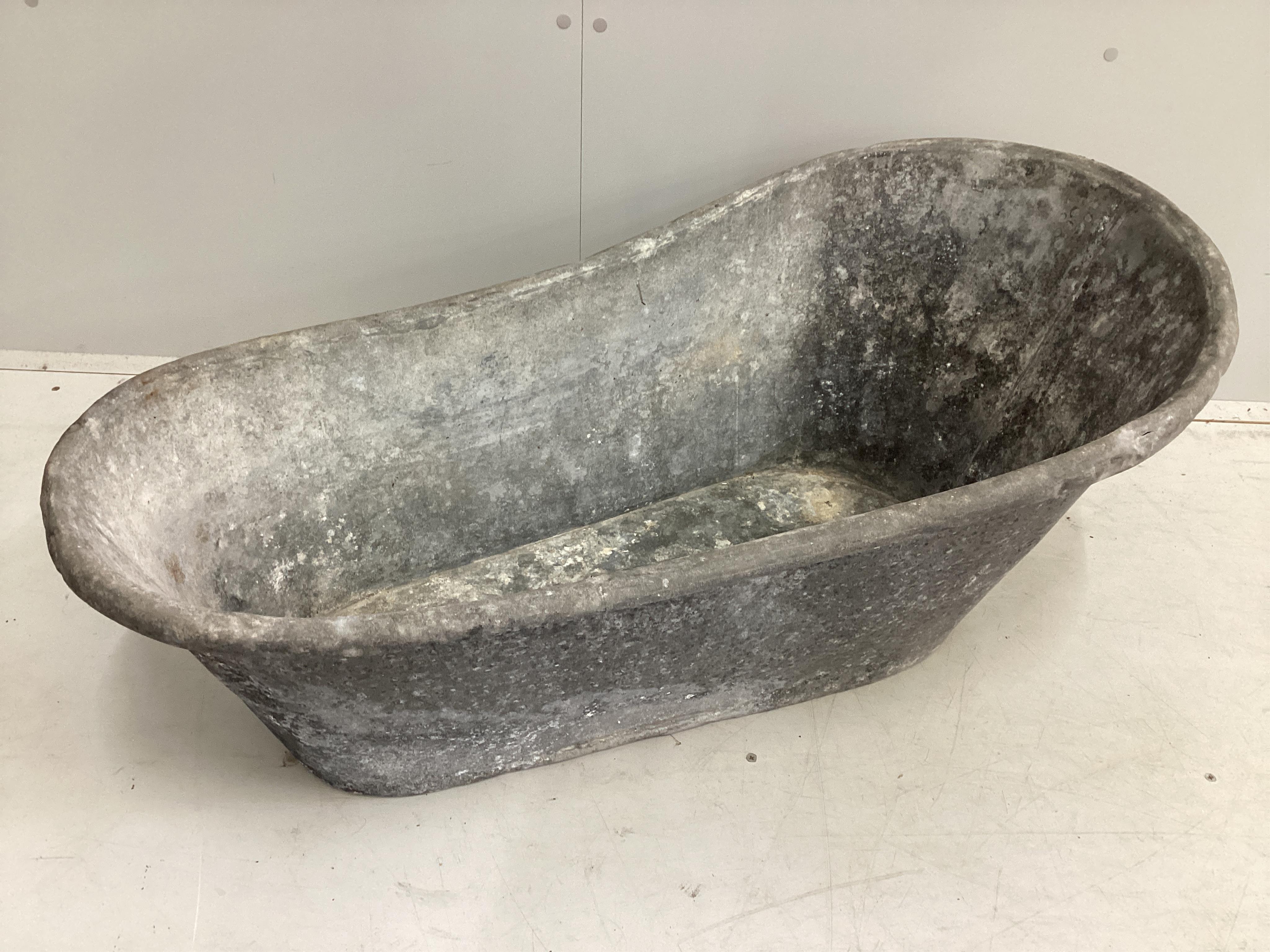 A vintage galvanised child’s bath, length 102cm, height 42cm. Condition - fair